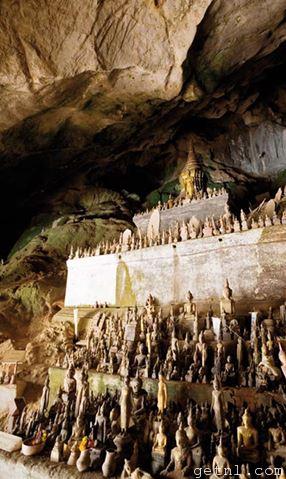 Buddha statues assembled in the Pak Ou Caves, Laos