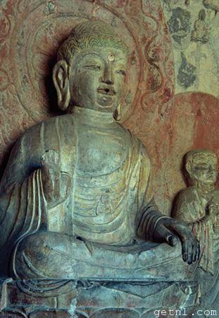 Close-up of a Buddha statue inside the Longmen Caves, China