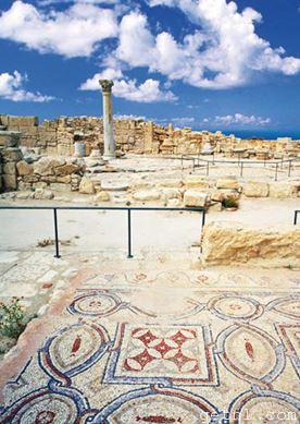 The ruined city of Kourion, Cyprus, with a well-preserved mosaic floor in the foreground