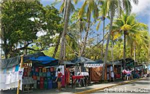 ABOVE Small shops and vendors lining First Beach at Manuel Antonio National Park, Costa Rica