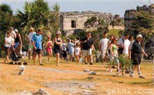 ABOVE Visitors touring the archaeological site of the Mayan ruins at Tulum, Mexico
