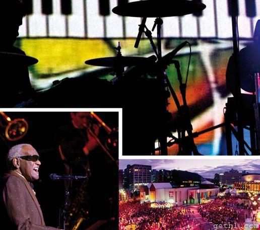 MAIN IMAGE Performers in front of the Montreal Jazz Festival’s logo BELOW (left to right) The legendary Ray Charles at the 2003 festival; panoramic view of a concert in one of the open-air venues