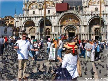 ABOVE Hordes of tourists – and pigeons – outside Basilica San Marco, Venice, Italy