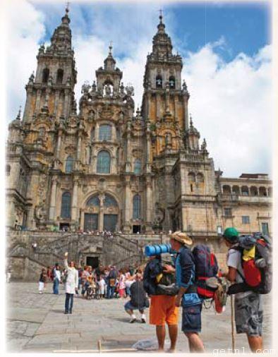 ABOVE Pilgrims arrive in front of the imposing Cathedral in Santiago de Compostela
