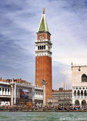 The Campanile, dominating St. Mark’s Square, seen from the perfect vantage point of the Grand Canal, Italy