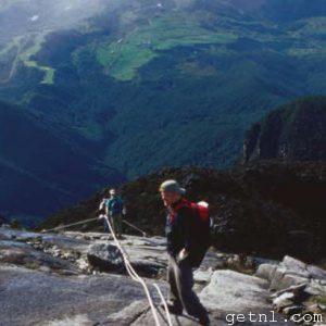 Climbers roping up for the challenging ascent of Mount Kinabalu’s rocky summit, Borneo