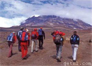 ABOVE Trekkers heading towards the summit of Africa’s legendary Mount Kilimanjaro