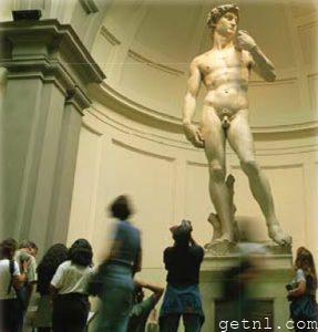 ABOVE Snap-happy visitors surrounding the majestic sculpture of David in Santa
