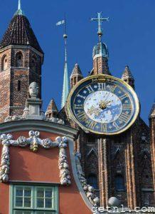 Close-up of the magnificent clock face on the red-brick St. Mary’s Church, Gdańsk, Poland